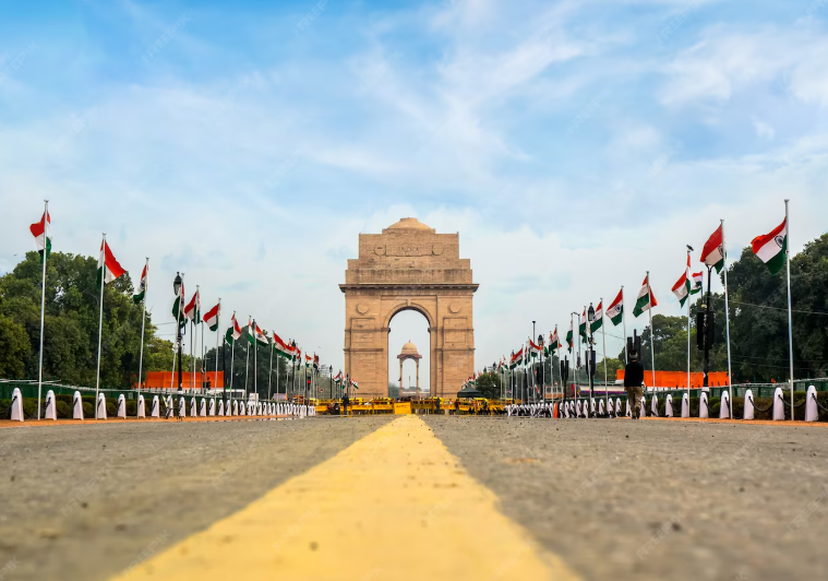 India Gate Delhi with Indian flags Independence Day decorations at India Gate Patriotic view of India Gate war memorial Road leading to India Gate monument India Gate images with tricolor flags India Gate Delhi Republic Day preparation Famous India Gate architecture with blue sky National flags near India Gate Delhi Iconic India Gate Delhi tourist attraction Front view of India Gate with flags