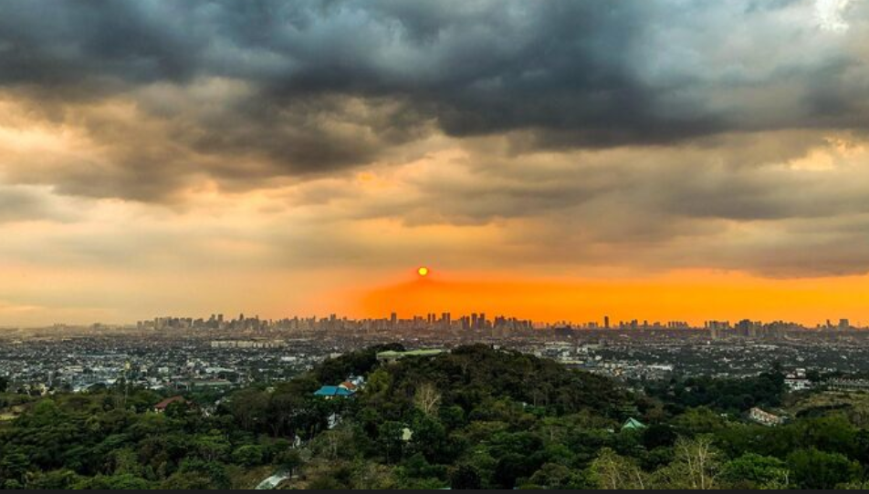 Sunset view of city skyline Delhi evening cityscape New Delhi skyline at sunset Orange sky over city buildings Beautiful sunset in Delhi City view with glowing sun Delhi skyline with clouds Sunset over New Delhi city Urban view in Delhi evening Scenic sunset sky in Delhi