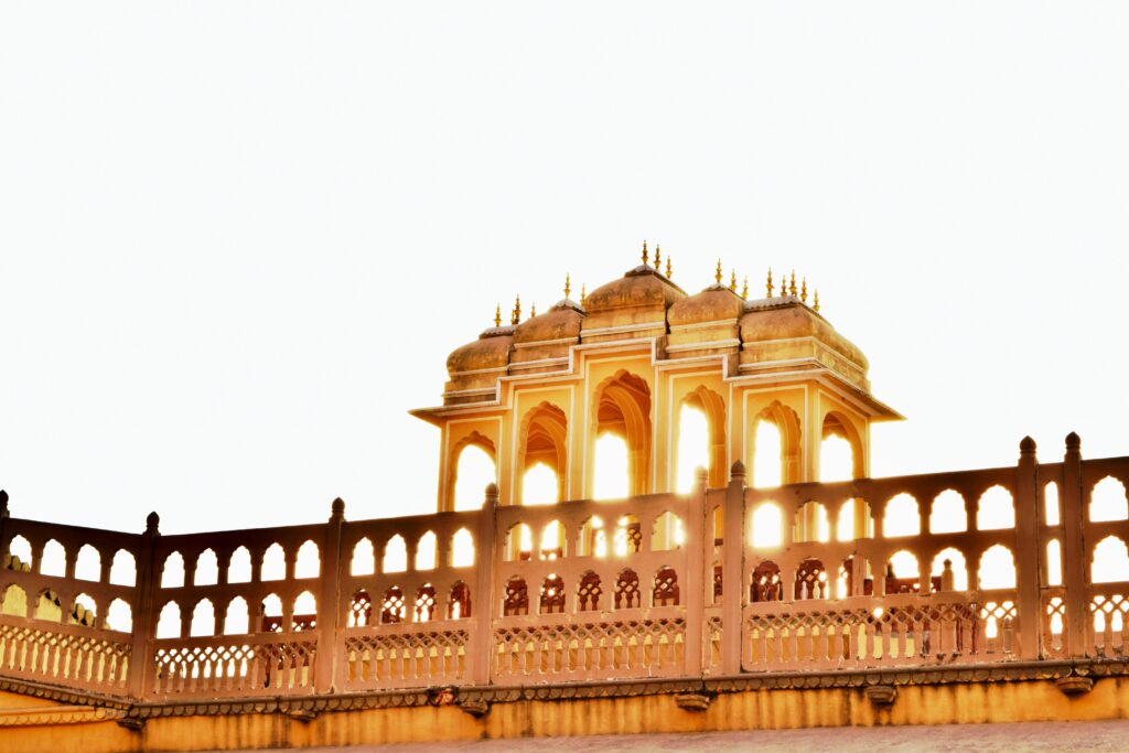 Hawa Mahal Jaipur pink sandstone facade Palace of Winds architecture Rajasthan India Intricate jharokhas latticework Hawa Mahal Pink City Jaipur historical monument Rajput Mughal architectural marvel Five-story Hawa Mahal ancient palace Jaipur travel destination photography India landmark red and pink sandstone Royal palace window design Jaipur Hawa Mahal Badi Chaupad street view