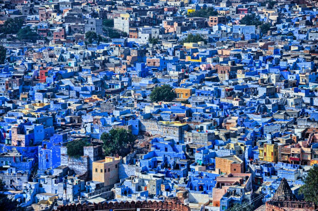 blue city jodhpur rajasthan india aerial view jodhpur blue houses densely packed urban landscape mehrangarh fort view blue painted houses vibrant blue architecture india travel photography jodhpur cityscape high angle shot historic blue town rajasthan traditional homes abhinav tripathi jodhpur photo credit indian blue city panorama travel background cluster of blue buildings rajasthan heritage city overhead shot indian city blue and ochre buildings